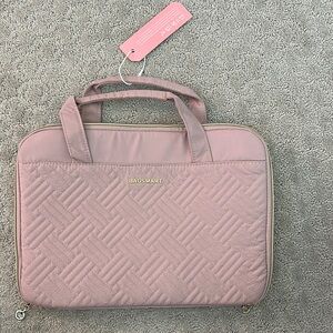 Sleek Pink Quilted Travel Bag with Sturdy Handles